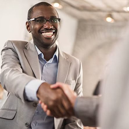 Two men shaking hands at a business meeting